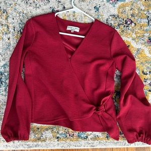 Red textured, crossbody blouse. Dress up or down. Comfortable. Loose sleeves